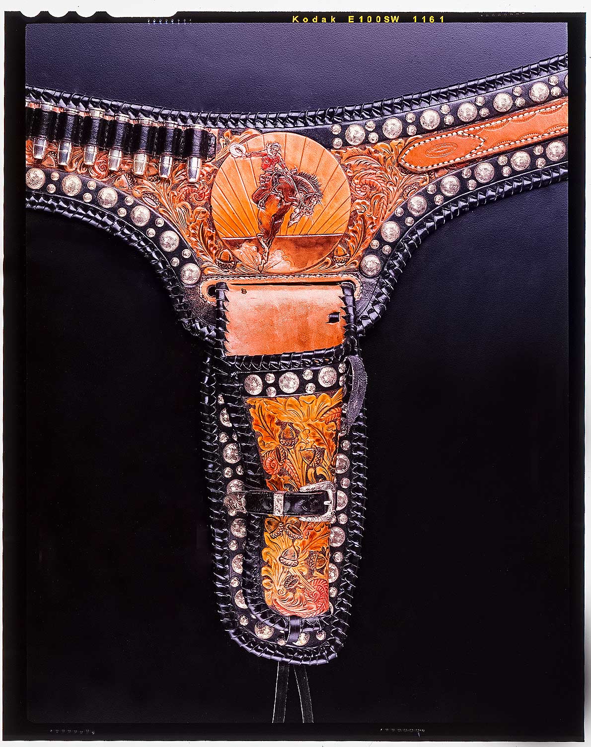 Gun belt -   Figure of Bronc rider taken from C.M. Russel
